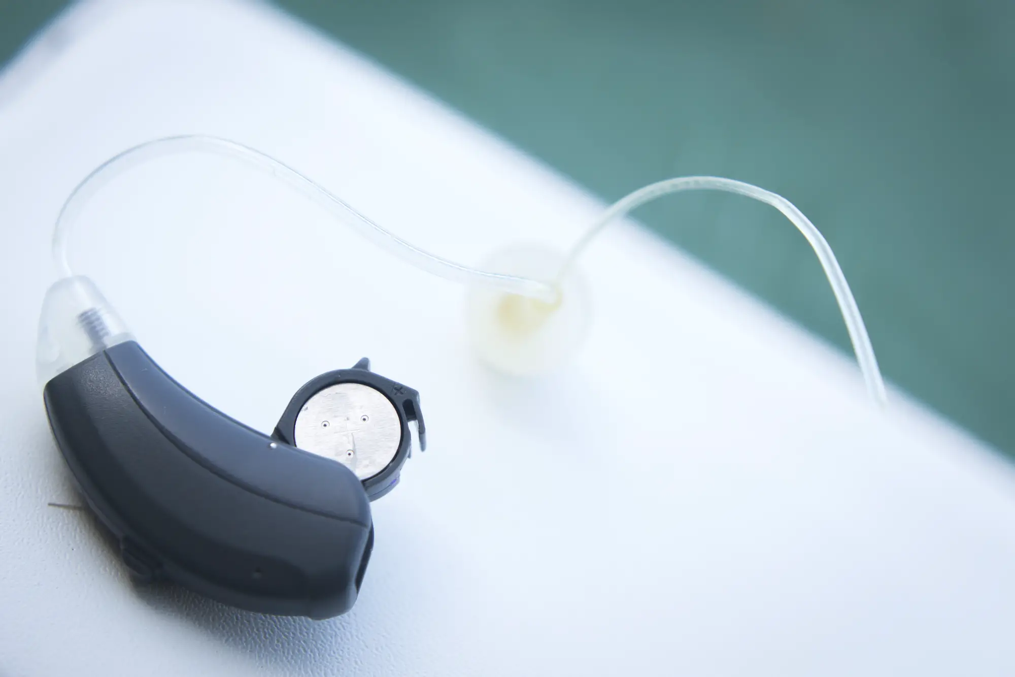 modern hearing aid with battery open ready to be changed