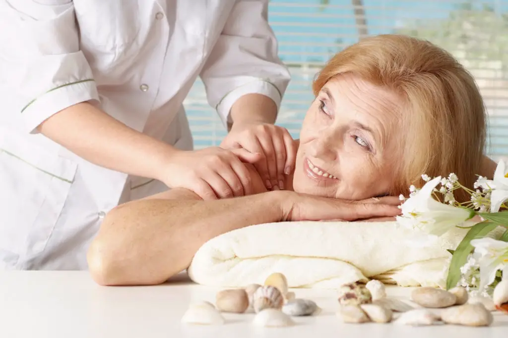 A senior woman gets a massage. 