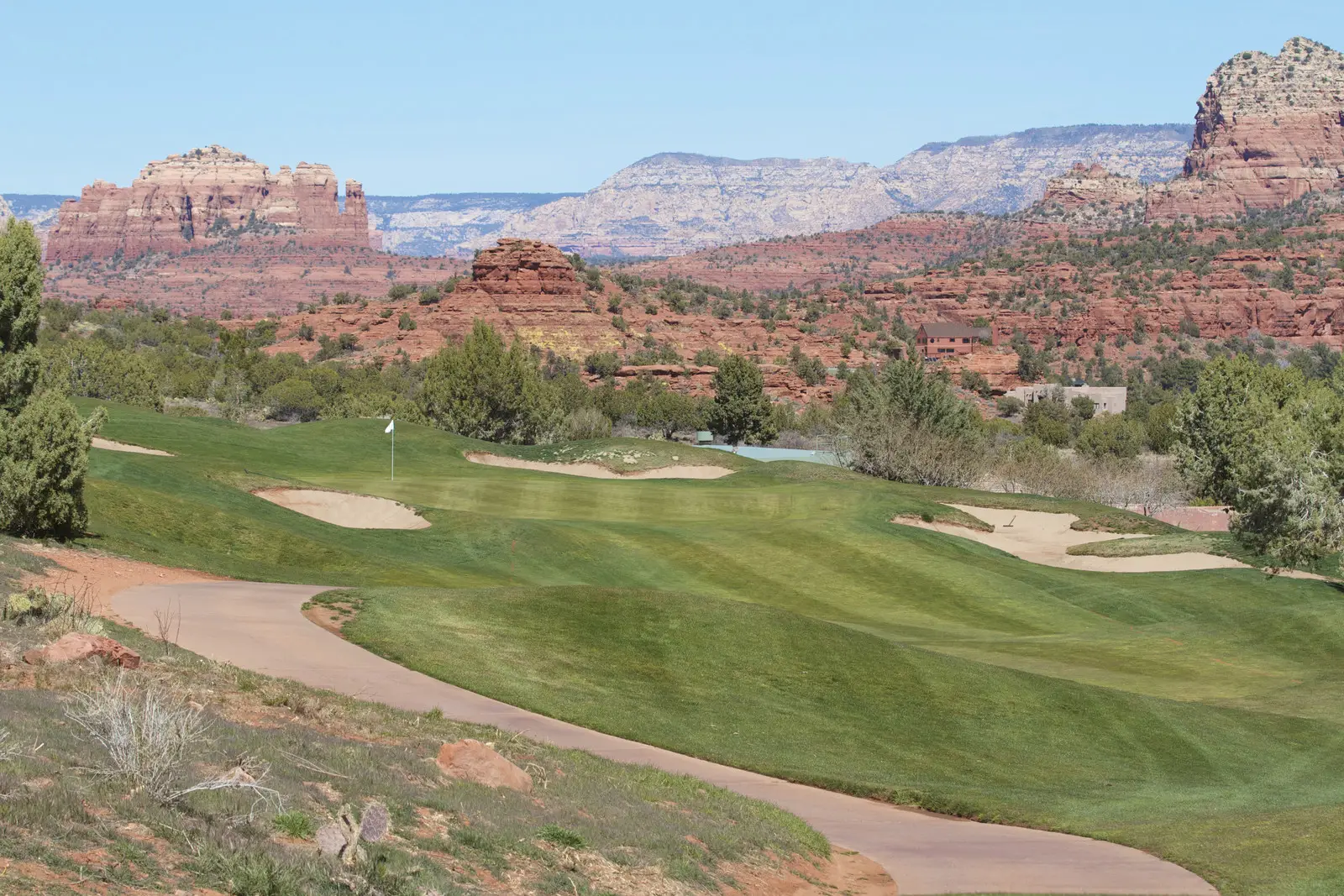 Golf course greens with a desert bacdkrop 