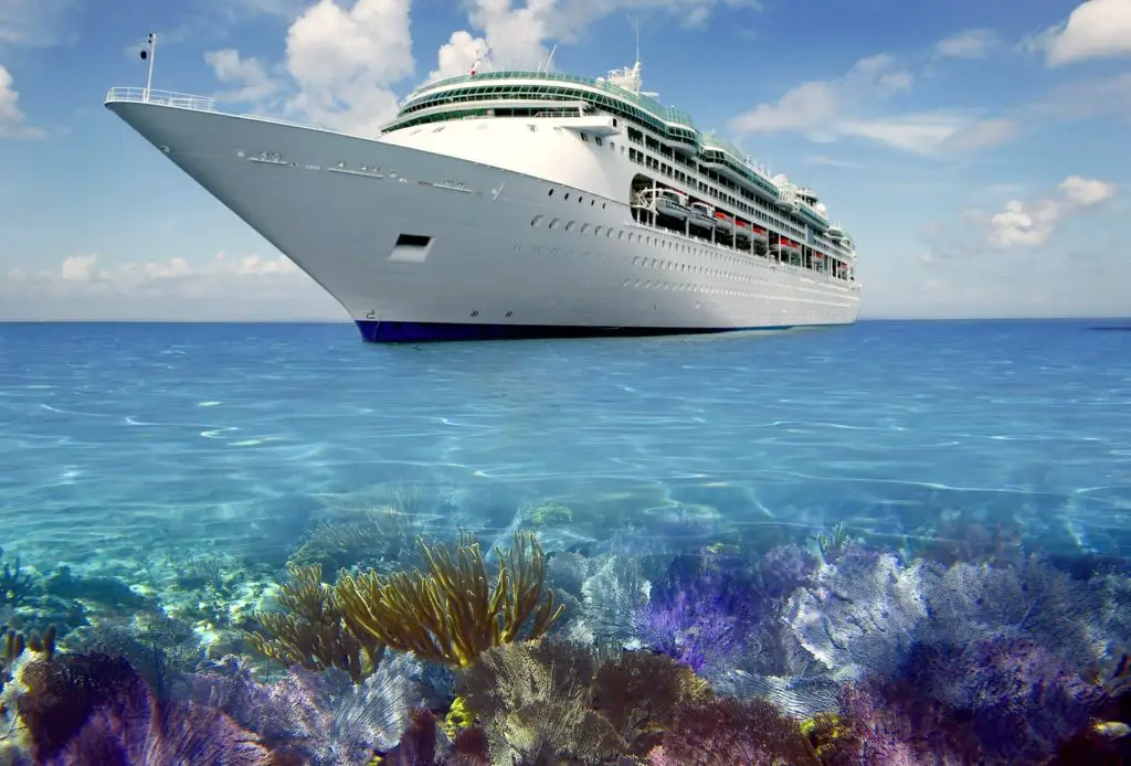 A cruise ship above a pretty reef in The Bahamas.