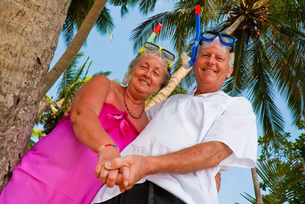Senior couple in snorkeling gear. 