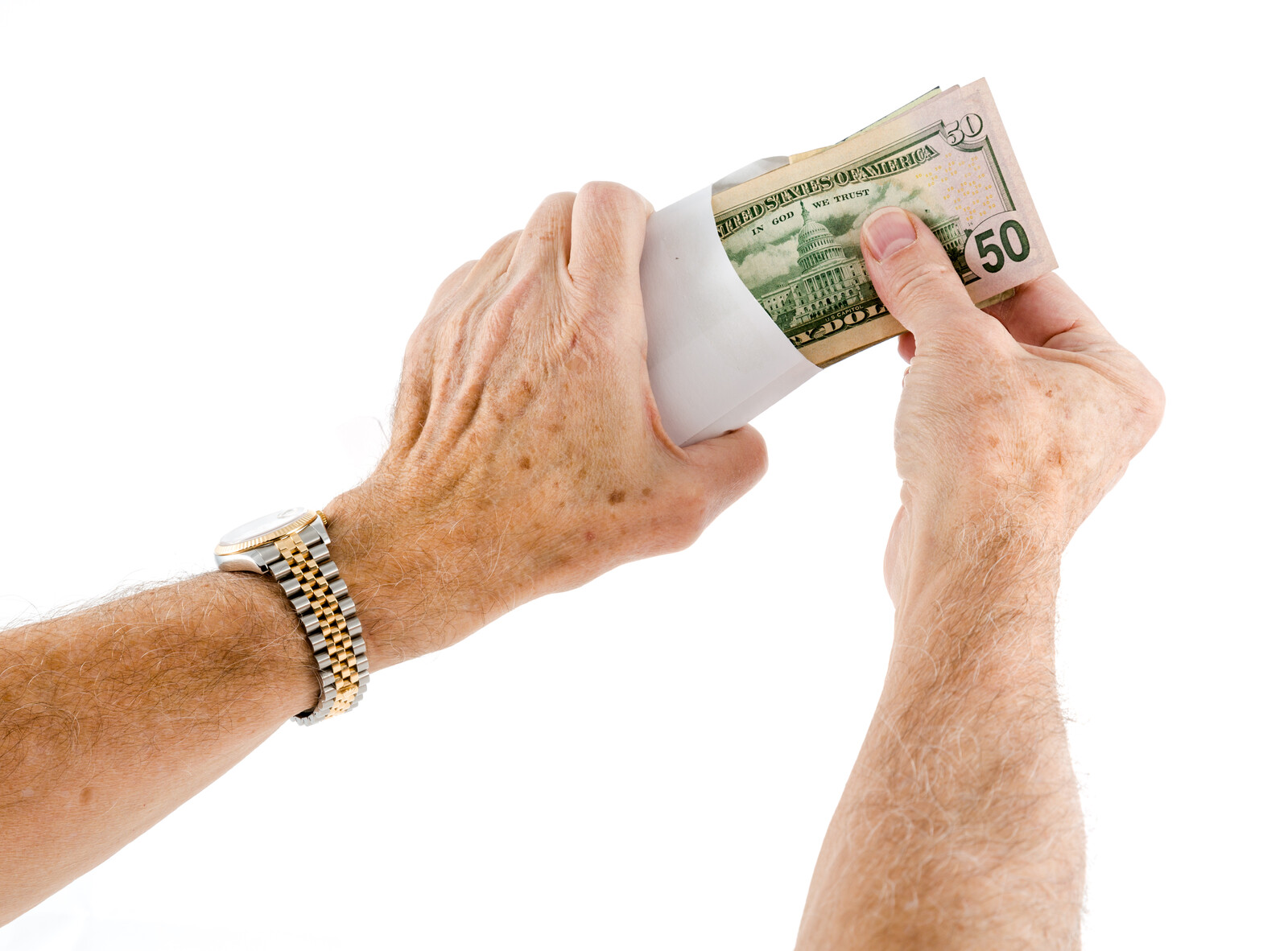 envelope of money being held in hands of senior man