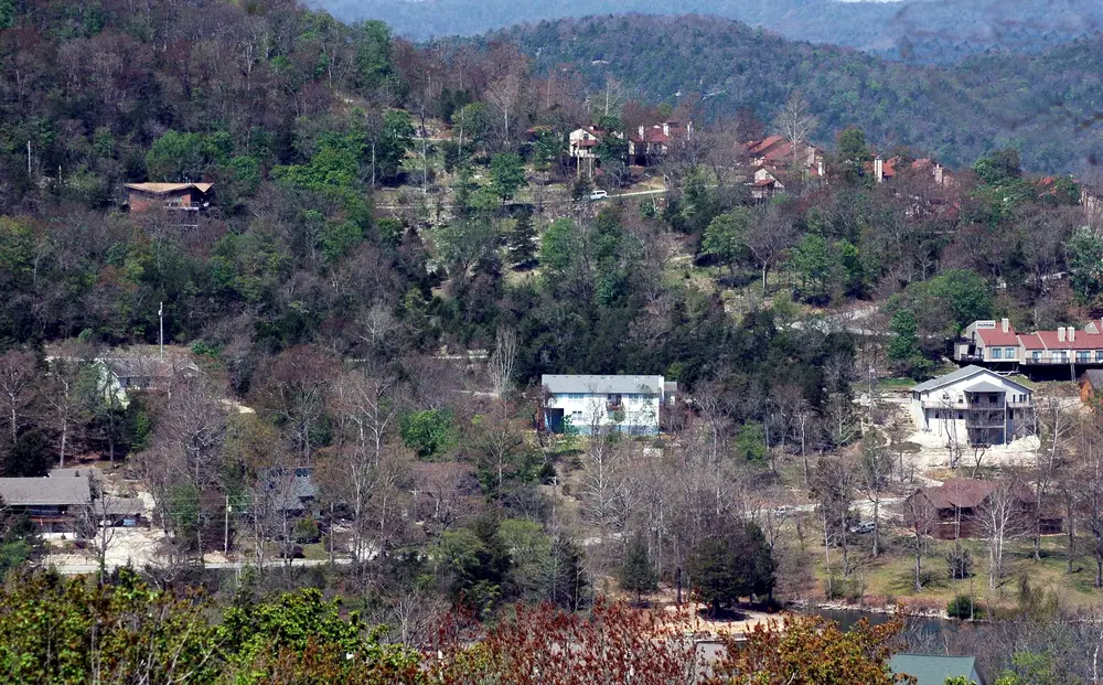 The Holiday Island with houses and trees, some of which have few leaves